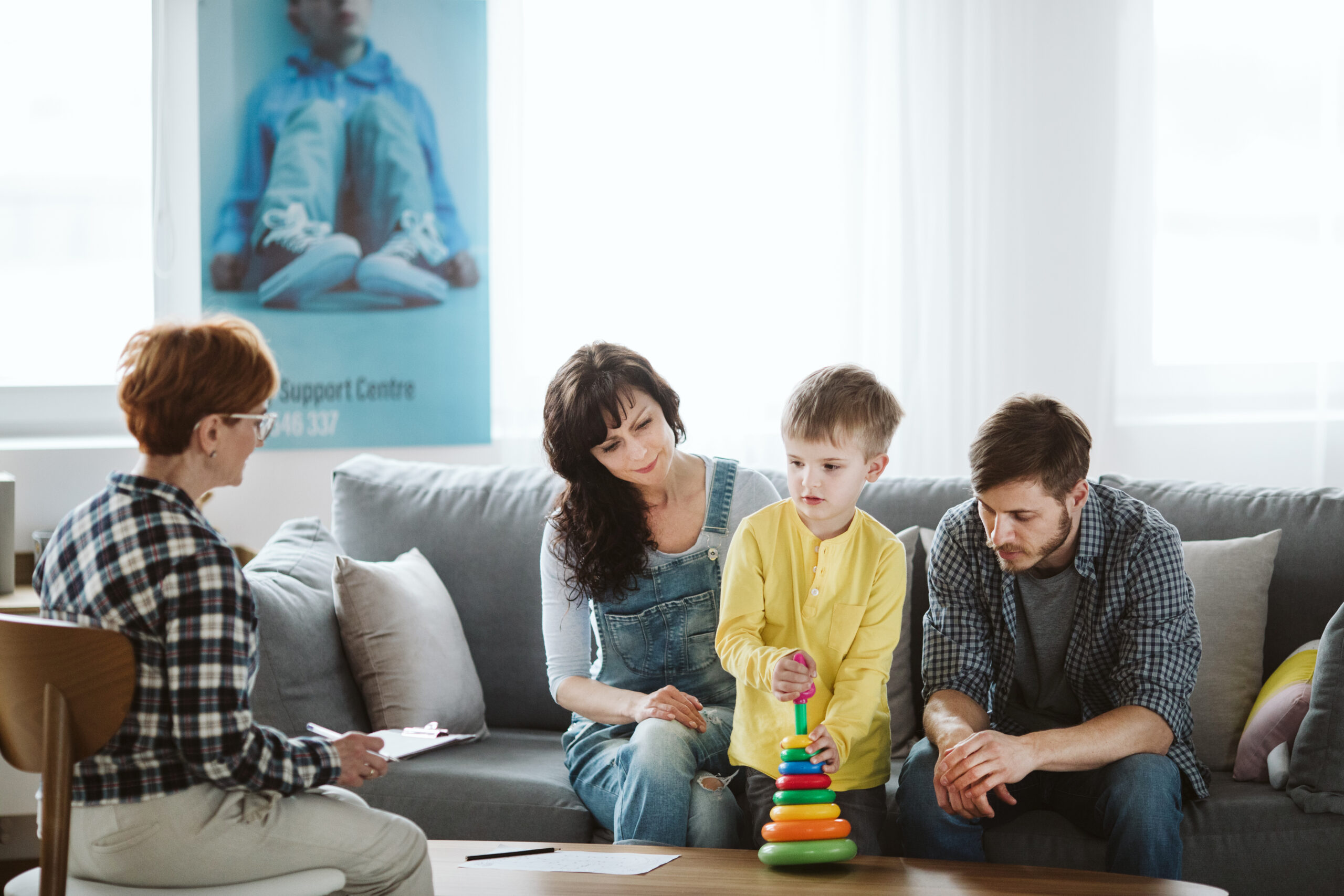 Support session meeting with 2 adults and young boy